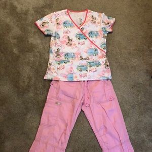 Scooby-Doo scrub top with light pink bottoms.